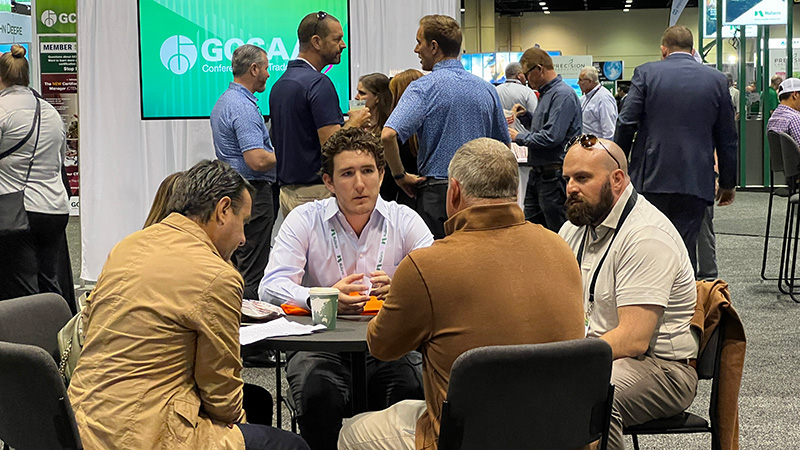 People gathered and talking at the 2023 GCSAA Conference and Trade Show