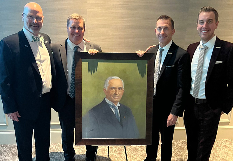 Mark Jordan, Jeff White, Rhett Evans and Shane Conroy pose with a portrait of Col. John Morley