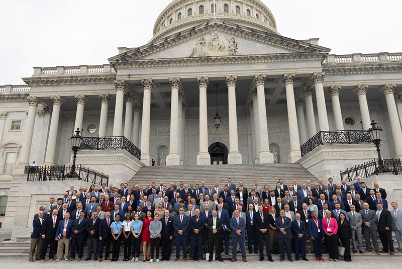 group of turf industry advocates on the steps of the Capitol building in Washington, D.C.