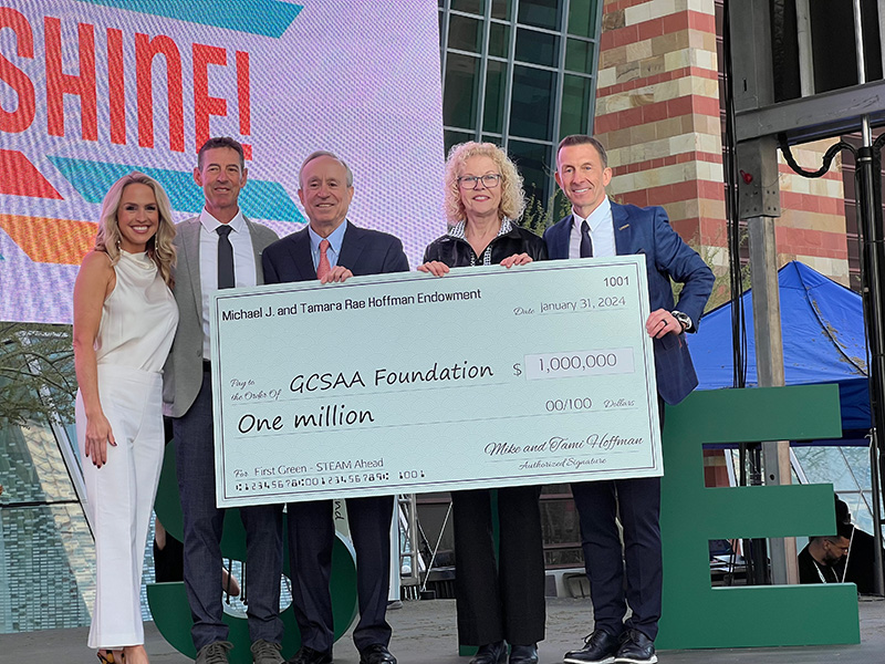 Lauren Thompson, Kevin Breen, Michael Hoffman, Tamara Hoffman and Rhett Evans holding up a large decorative check to the GCSAA Foundation for one million dollars