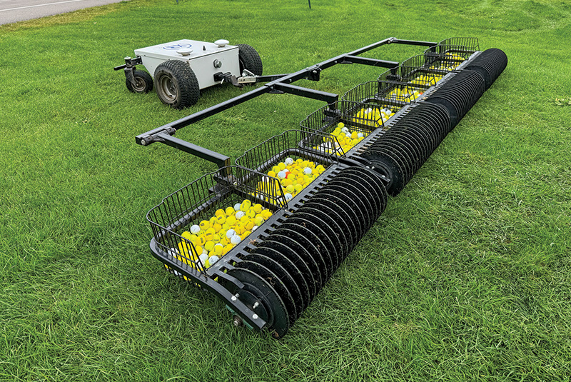 Autonomous ball collector on an astroturf rug at the GCSAA Conference and Trade Show