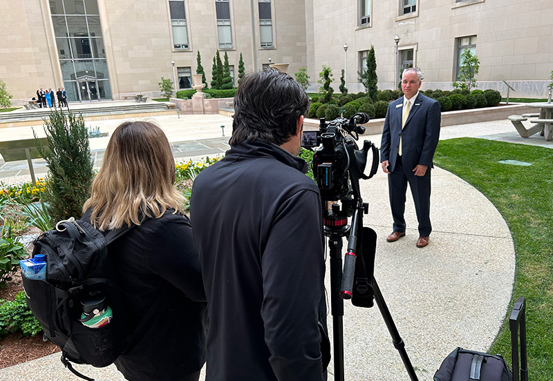 Camera crew shooting an interview with a GCSAA member