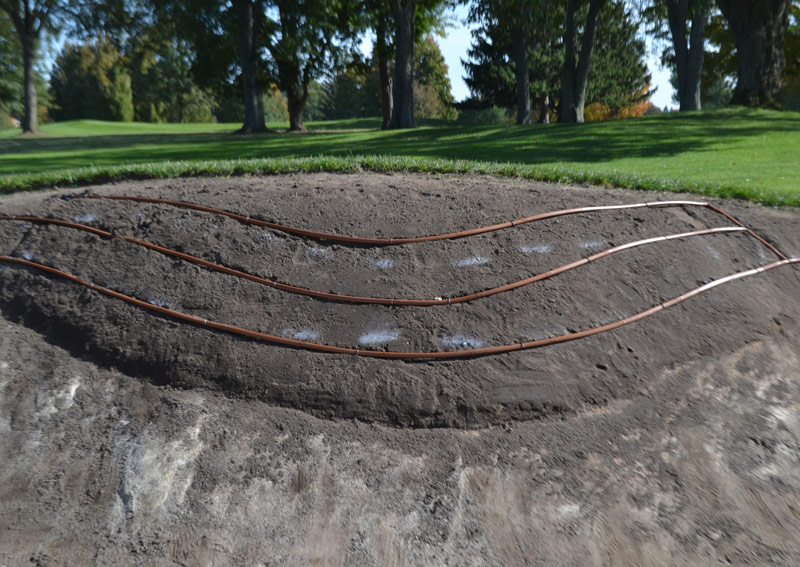 Drip irrigation golf bunker