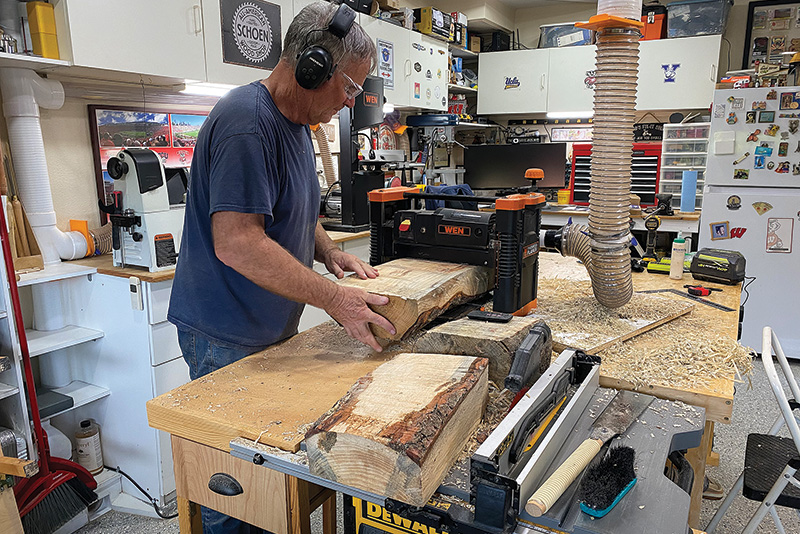 man woodworking in a shop
