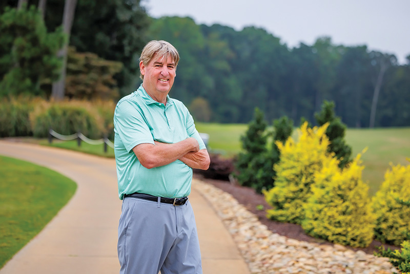 Shawn Emerson standing outside on a golf course