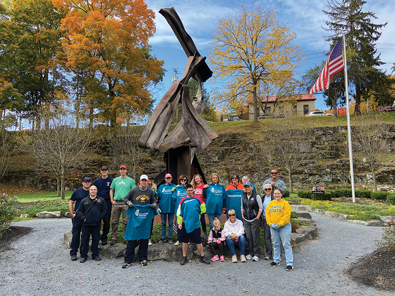 Photo of a group of volunteers at the 9/11 memorial in Saratoga Springs, N.Y.