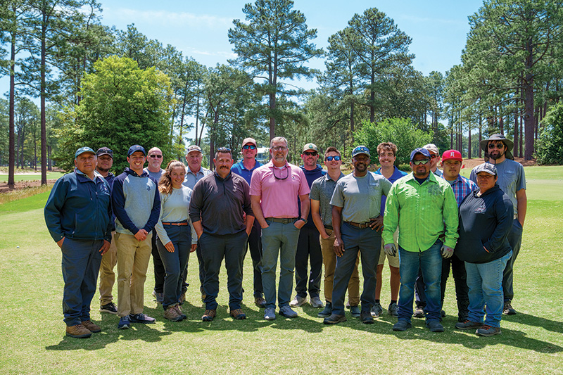 Group photo of John Jeffreys and crew outdoors on Pinehurst No. 2