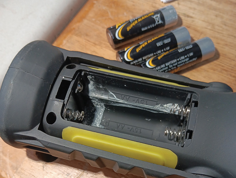 A pair of leaking alkaline batteries