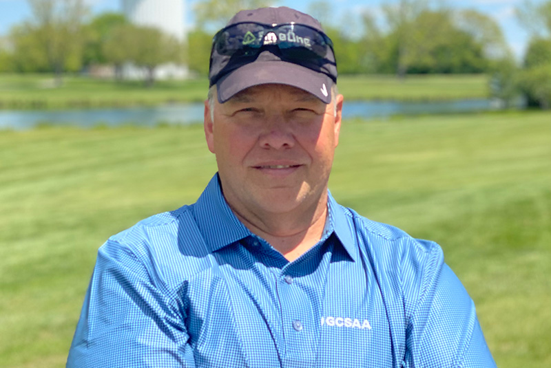 Damon Hitti in a blue polo shirt and baseball cap