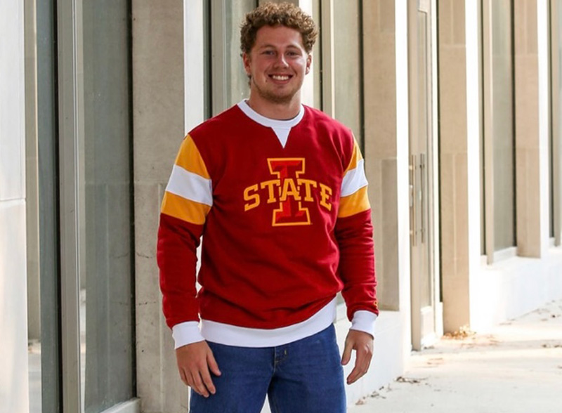 Blake Mann wearing a red Iowa State sweatshirt